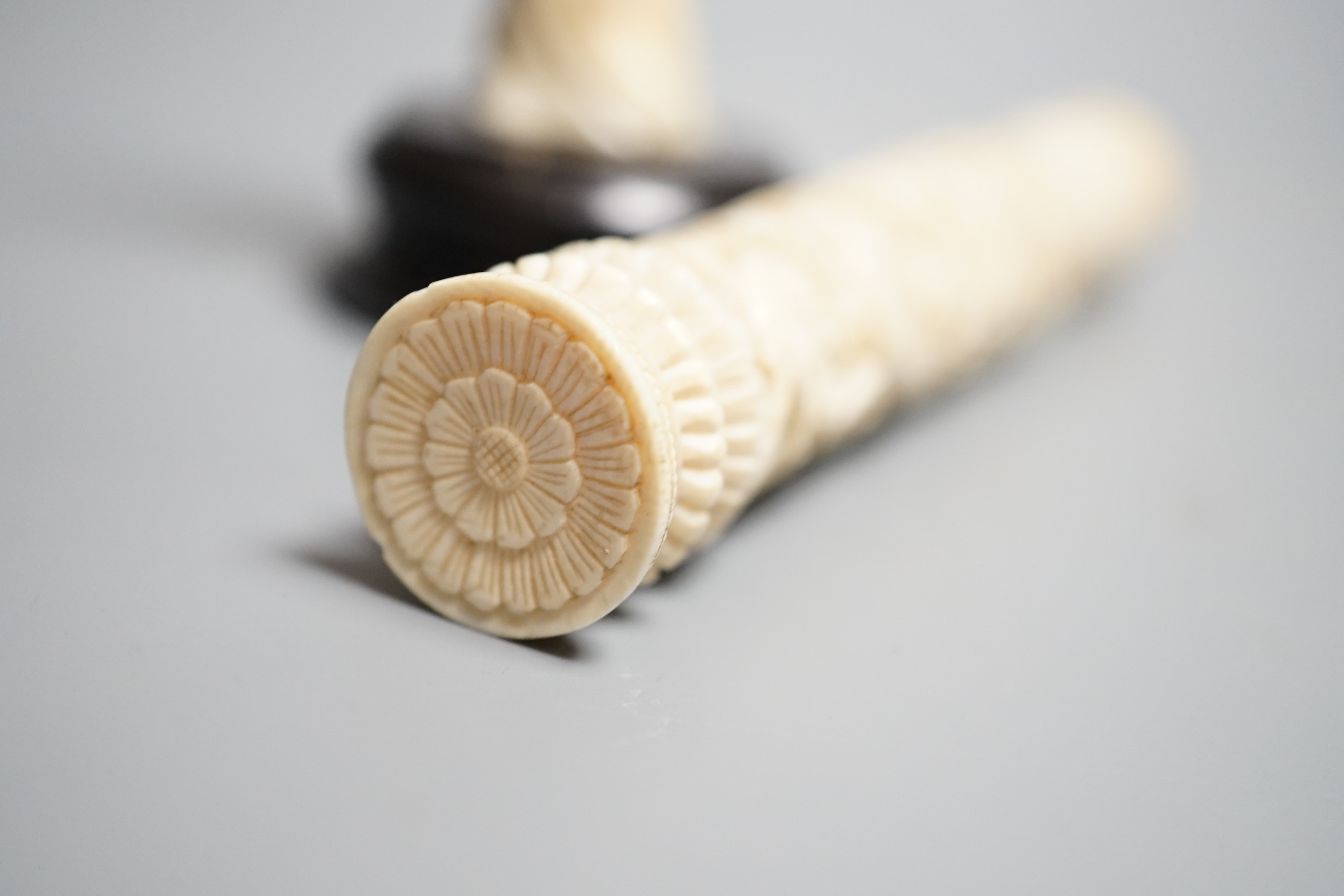 A Chinese export carved ivory bodkin case, 16cm, and a Japanese ivory figure of a geisha